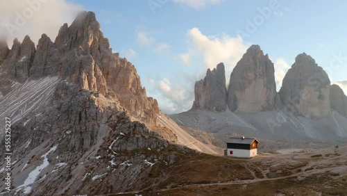 4k drone forward video of stunning morning in Tre Cime Di Lavaredo National Park. Fantastic autumn scene of Dolomite Alps, Auronzo location, Italy, Europe. Ultra High Definition..