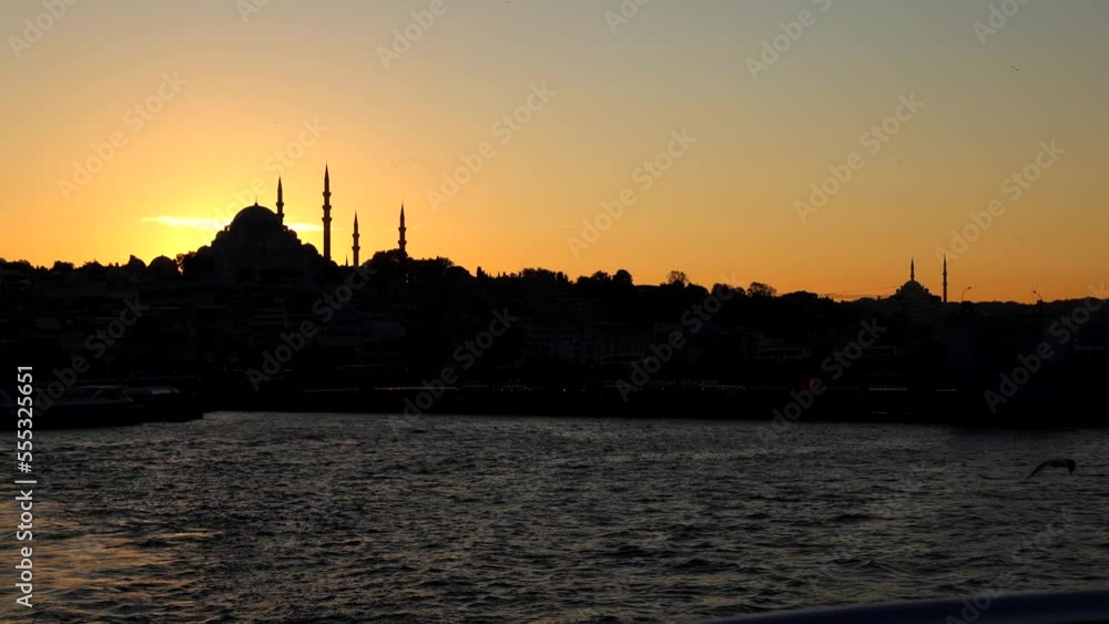 Silhouette of Istanbul at sunset with seagulls from a ferry. Travel to Istanbul background 4k video. Silhouette of Istanbul at sunset with seagulls from a ferry. Travel to Istanbul background 4k video.