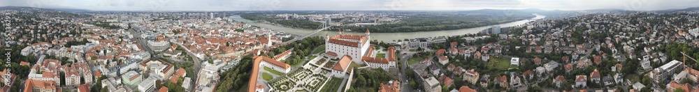 Bratislava, Slovakia - August 26, 2022: Aerial view of city castle and skyline at sunset. Panoramic viewpoint from drone