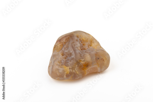 Multicolored gemstones, tumbled minerals. Bostwan agate of various sizes on a white background.