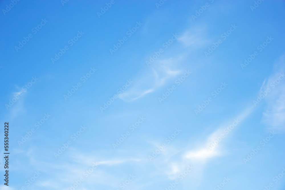 Blue sky background and white clouds soft focus, and copy space horizontal shape.