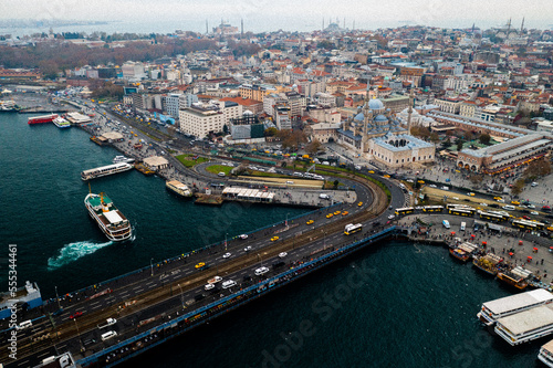 People on Galata Bridge in Istanbul, Turkey. Galata Bridge and Eminonu are the most popular destinations for entertainment and travel of Istanbul.