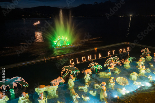 Christmas crib submerged and illuminated by colored lights in the water of Lake Maggiore in Laveno