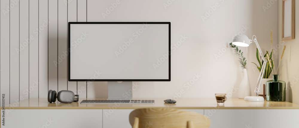 Fototapeta premium Comfortable and minimal working table with computer mockup and decor on wood table