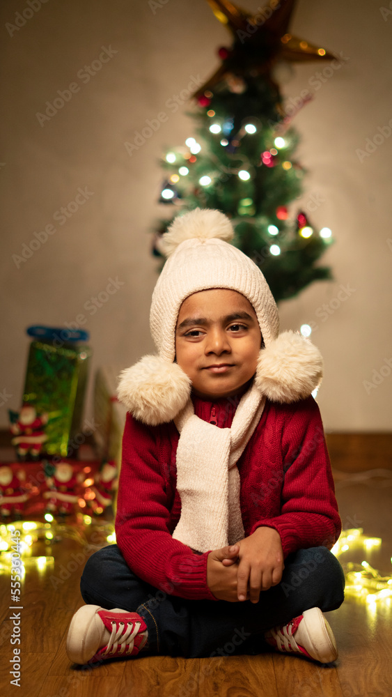 happy Indian child boy with christmas tree happy Indian child boy with christmas tree