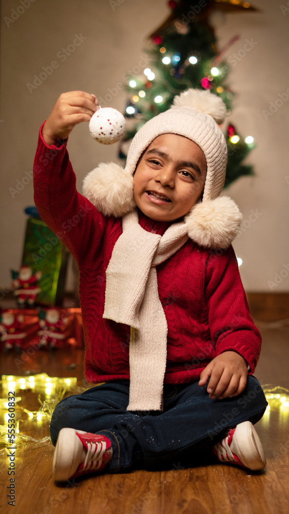 happy Indian child boy with christmas tree happy Indian child boy with christmas tree