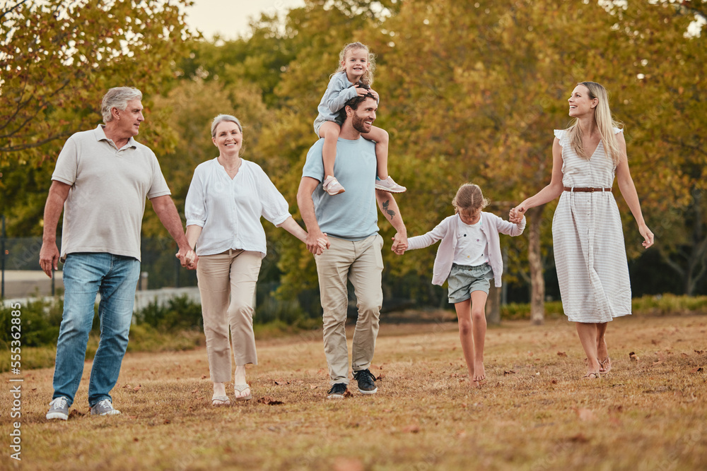 Fototapeta premium Happy family, holding hands or walking with children in park for summer holiday, vacation break or bonding activity. Smile, happy kids or mother, father or senior retirement elderly in nature garden
