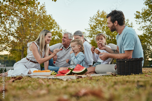 Photography Watermelon, love or big family in nature on a picnic eating healthy fruit or food on summer holiday vacation in Berlin