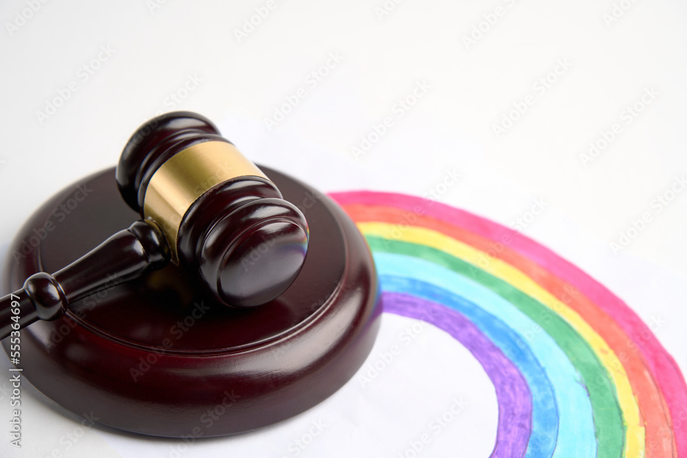 Judge gavel and LGBT rainbow on a white background Judge gavel and LGBT rainbow on a white background
