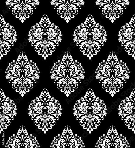 Wallpaper in the style of Baroque. Seamless vector background. White and black floral ornament. Graphic pattern for fabric, wallpaper, packaging. Ornate Damask flower ornament