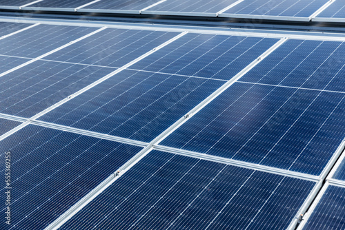 Solar power panels on the roof for green energy. Solar panels on factory roof photovoltaic solar panels absorb sunlight. 