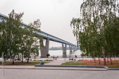 Novosibirsk, Russia, August 2022: Embankment in Novosibirsk and bridges across the Ob River in summer