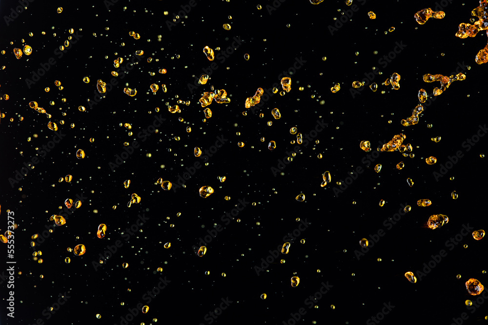 Orange, lemon juice or oil lubricant splash, liquid gold yellow drink drops. Fruit beverage water elements in line form . Fresh splashing and flowing jets, black background isolated freeze motion Orange, lemon juice or oil lubricant splash, liquid gold yellow drink drops. Fruit beverage water elements in line form . Fresh splashing and flowing jets, black background isolated freeze motion