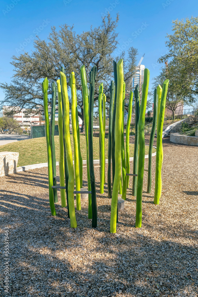 Fototapeta premium Austin, Texas- Playground at Waterloo Park with painted green wood obstacle