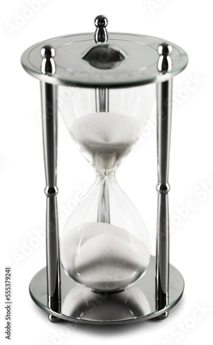 Sand running through the bulbs of an old retro hourglass