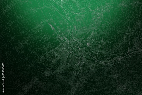 Street map of Basel (Switzerland) engraved on green metal background. Light is coming from top. 3d render, illustration