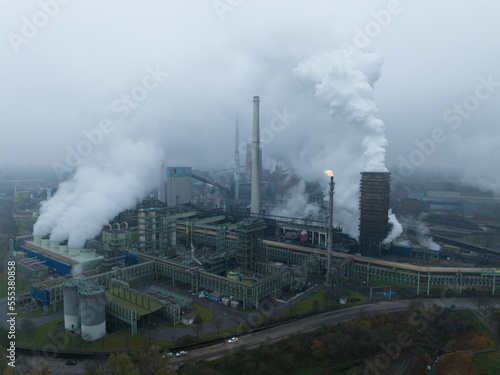 Ruhr area, Heavy industrial area near Dusseldorf. Coal mines, blast furnaces, steel mills, German industrial engineering and steel production. Aerial drone overhead view.