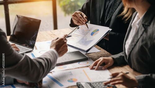 Billede på lærred Businessman and team analyzing financial statement Finance task