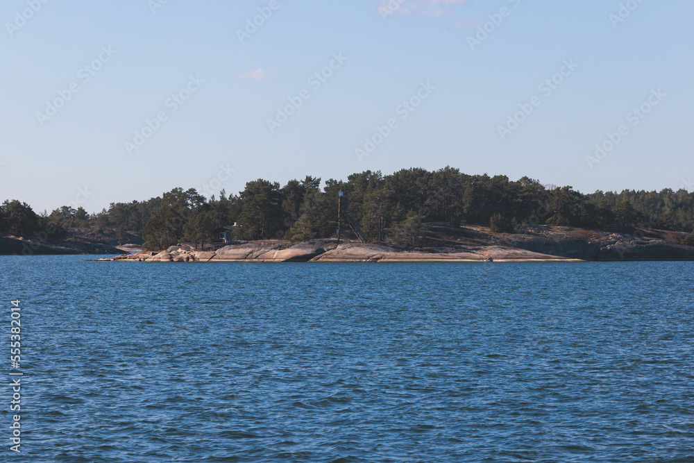 Archipelago National Park landscape, Southwest Finland, with islands, islets and skerries, Saaristomeren kansallispuisto, summer sunny day, view from shuttle ship ferry boat in the Archipelago Sea Archipelago National Park landscape, Southwest Finland, with islands, islets and skerries, Saaristomeren kansallispuisto, summer sunny day, view from shuttle ship ferry boat in the Archipelago Sea