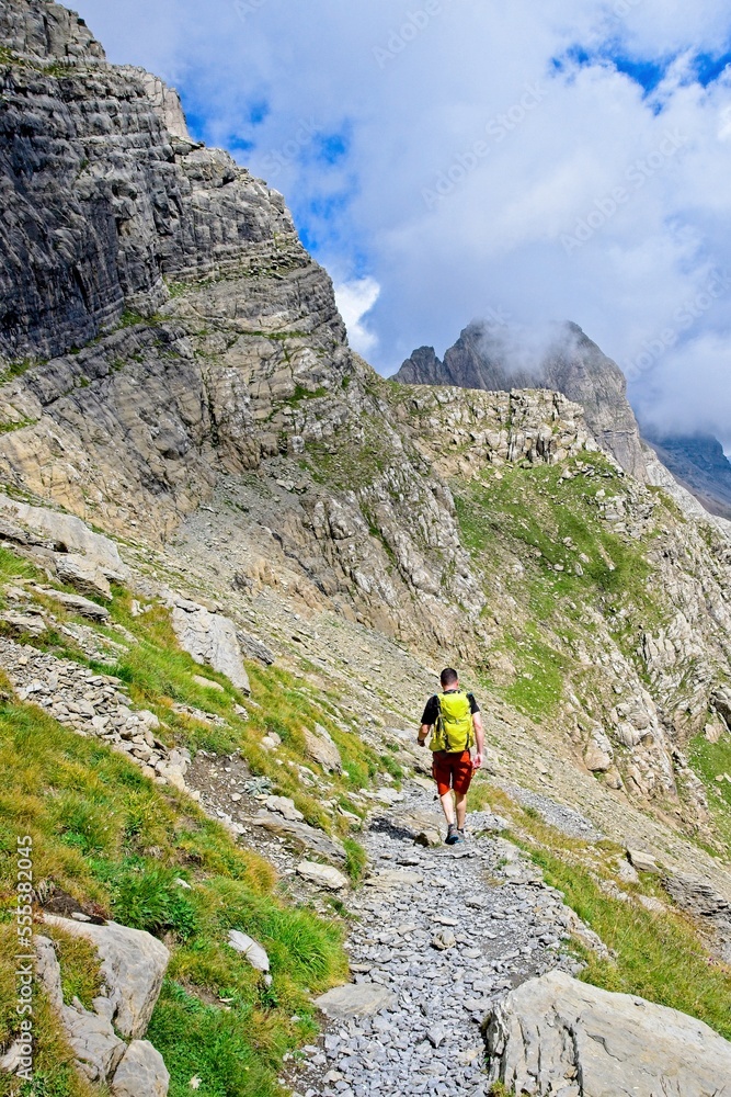A man hikes the trail to Balcon de Pineta, a popular route in the Spanish Pyrenees