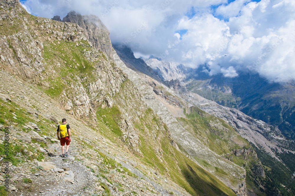 A man hikes the trail to Balcon de Pineta, a popular route in the Spanish Pyrenees
