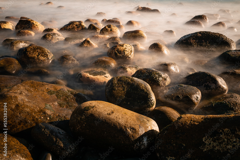 Obraz premium stones in the sea at Ribeira da Janela beach on the island of Madeira