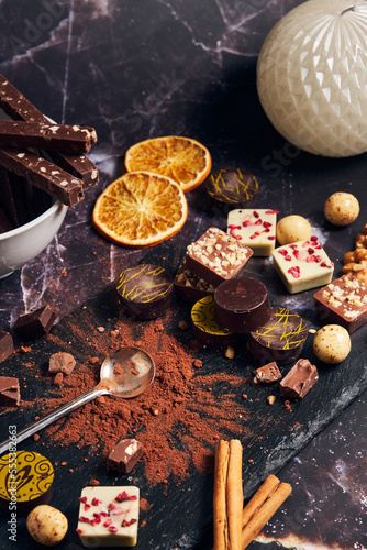 a variety of chocolates on a dark background