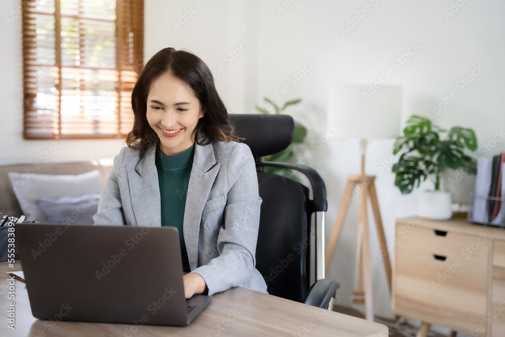 Business women hand working with tablet and laptop computer with documents on office desk in modern office. Business women hand working with tablet and laptop computer with documents on office desk in modern office.