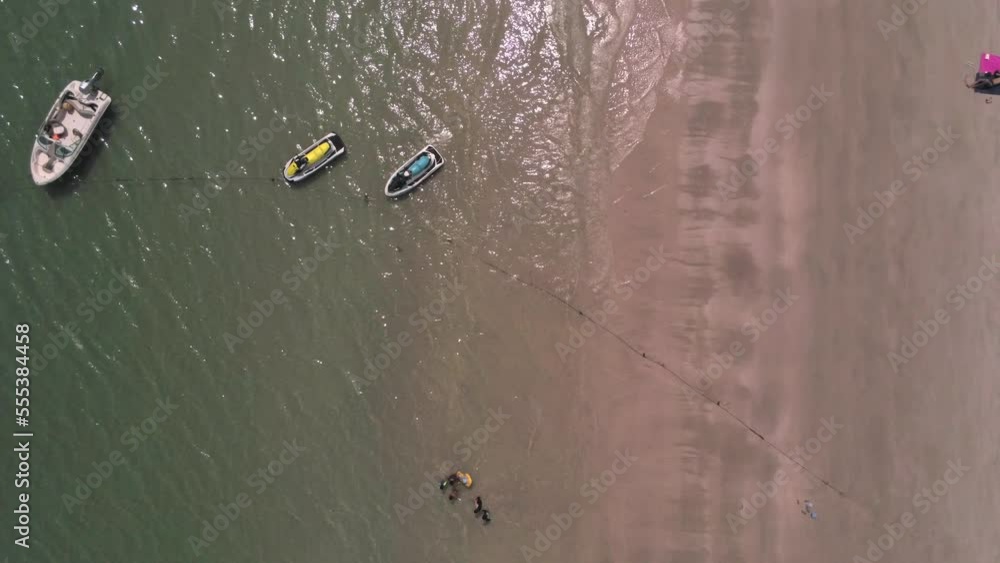 Top view on sandy beach and azure sea on sunny day. Aerial shot, drone footage. Travel, vacation concept Top view on sandy beach and azure sea on sunny day. Aerial shot, drone footage. Travel, vacation concept