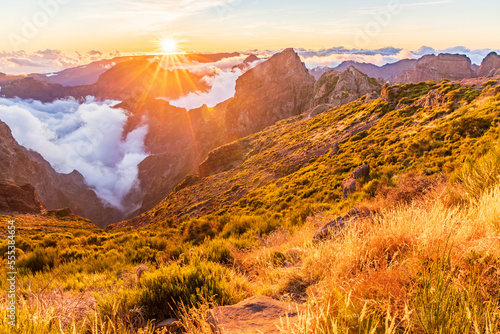 sunset over the mountains, Madeira, Portugal. Clouds over the valley. Pico do Arieiro mountain