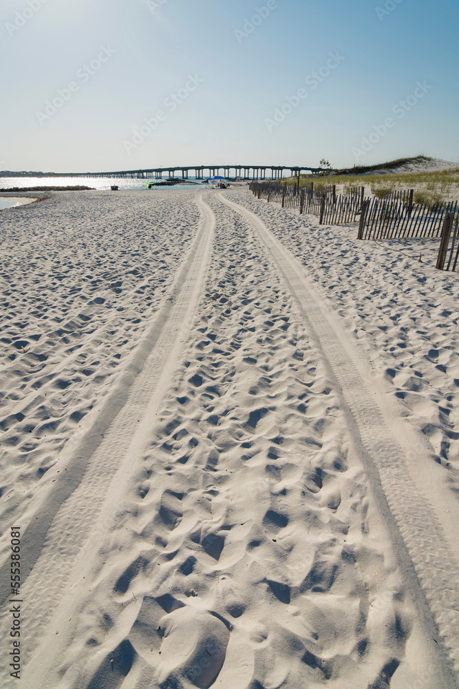 Off-road on the beach with wheel tracks at Destin, Florida Off-road on the beach with wheel tracks at Destin, Florida