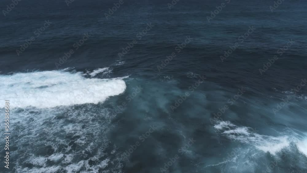 Big ocean waves with white foam are splashing. Tsunami, power of ocean concept. Aerial view, drone shot Big ocean waves with white foam are splashing. Tsunami, power of ocean concept. Aerial view, drone shot