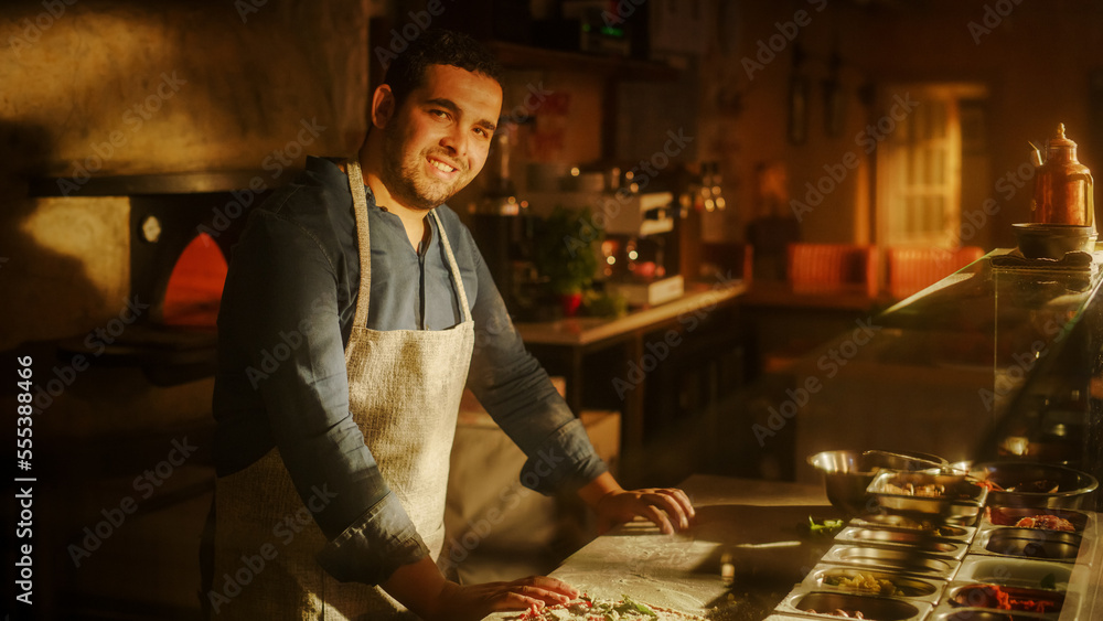In Restaurant Professional Chef Preparing Pizza, Kneading Dough, Adding Ingredients, Special Sauce, Traditional Family Recipe. Authentic Italian Pizzeria with Delicious Organic Food. Focus on Hands