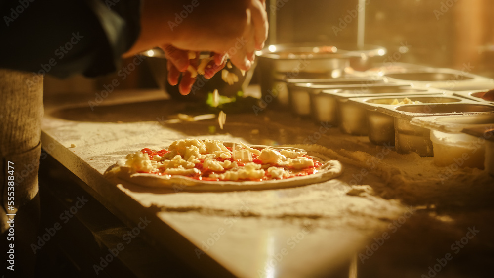 In Restaurant Professional Chef Preparing Pizza, Kneading Dough, Adding Ingredients, Cheese, Vegetables, Traditional Family Recipe. Authentic Pizzeria with Delicious Organic Food. Focus on Hands