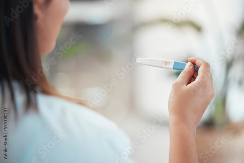Tableau sur toile Woman, hands and pregnancy test with results, information and blank at home