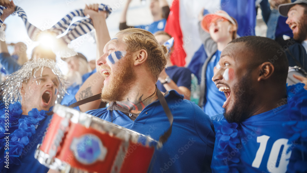 Sport Stadium Big Event: Three Diverse Fans with Painted Faces Cheering, Beating the Drum, Laughing, Having Fun, Shout for Soccer Team to Win. People Celebrate Scoring a Goal, Championship Victory