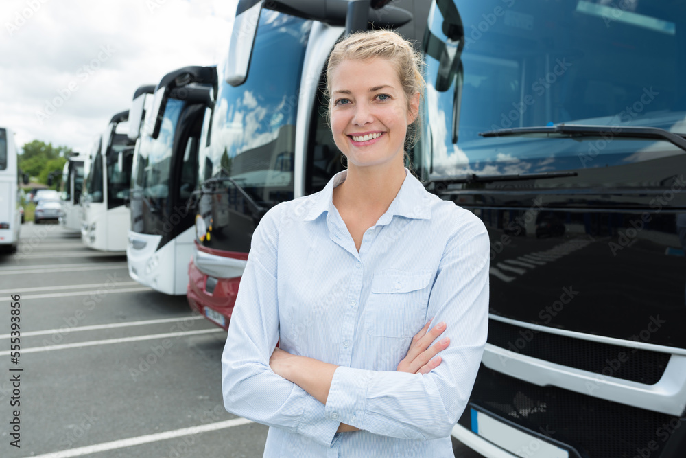 woman posing in front of bus woman posing in front of bus