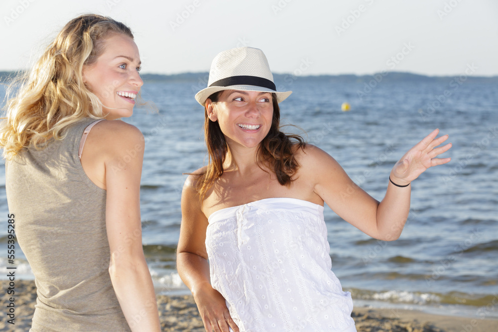 woman friends on the beach woman friends on the beach