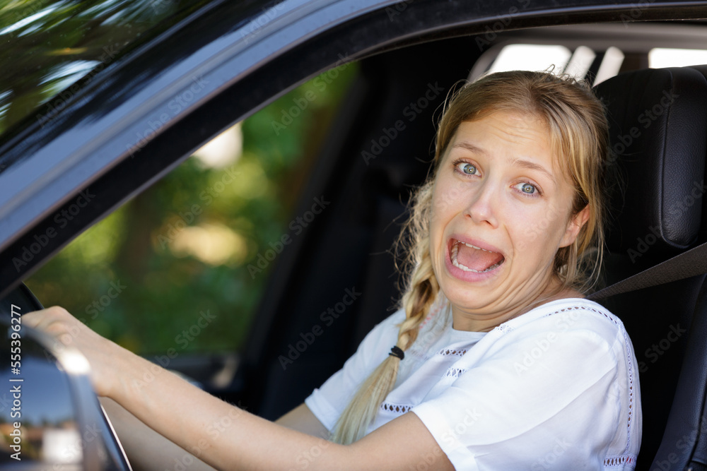 young pretty woman scared in the car young pretty woman scared in the car