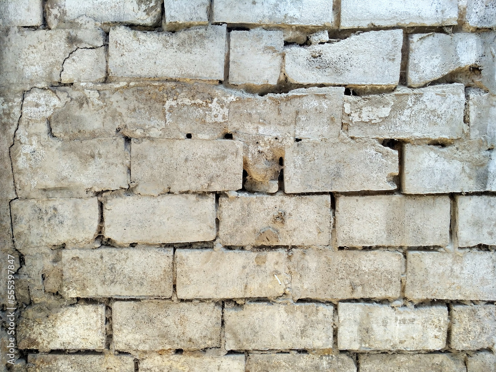 Old cinder block wall texture with crumbled seems Old cinder block wall texture with crumbled seems