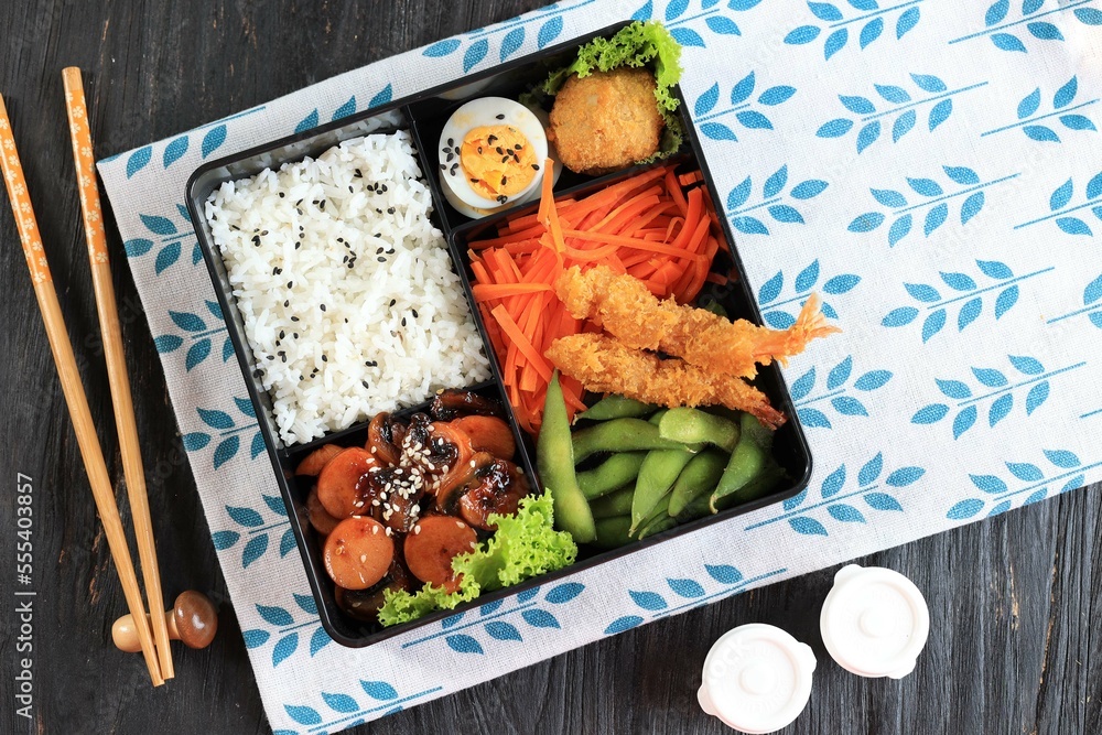 Top View Japanese Bento Box With Teriyaki Sausage Carrot Steamed Egg