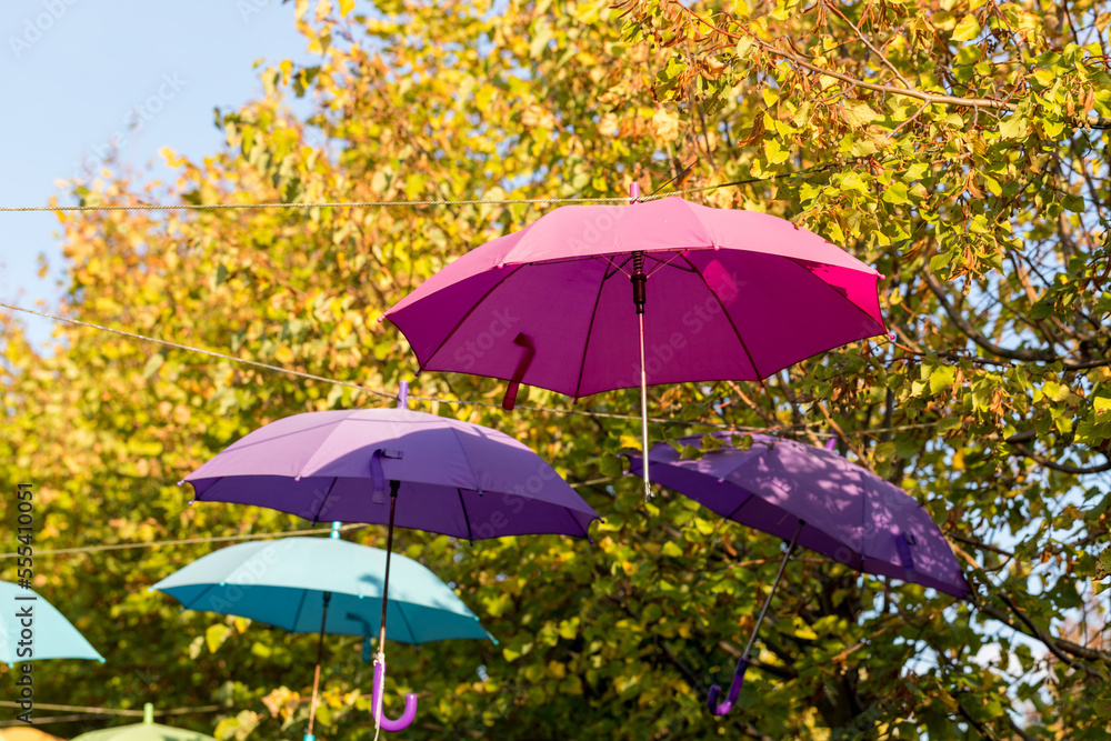 Colorful umbrellas hung above the street.