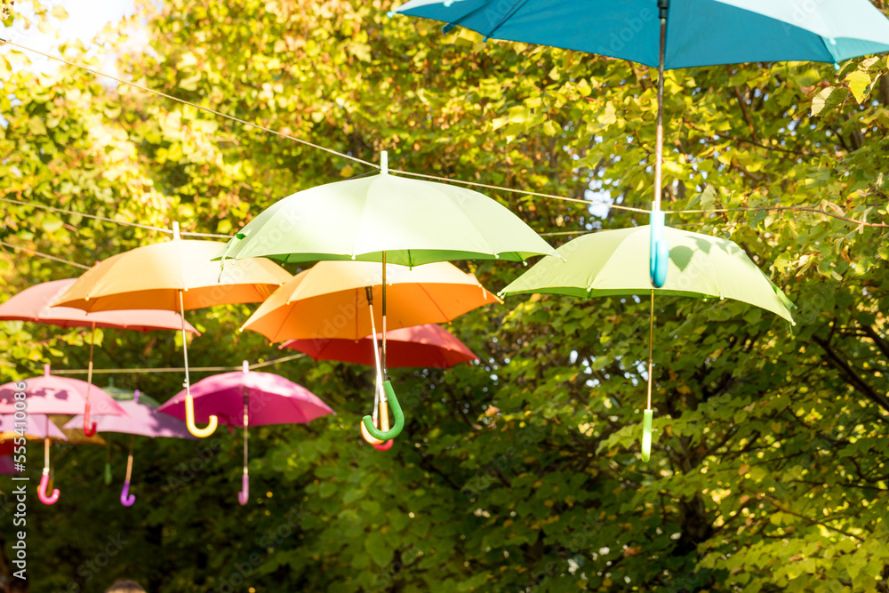 Colorful umbrellas hung above the street.