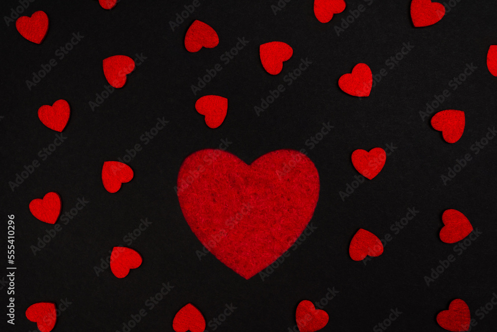 Black and red background decorated with red hearts, a banner for discounts or congratulations