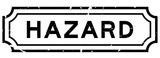 Grunge black hazard word rubber seal stamp on white background