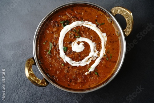 Dal Makhani | Indian vegetarian black lentil curry served in kadai, selective focus photo
