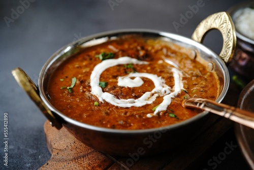 Dal Makhani | Indian vegetarian black lentil curry served in kadai, selective focus