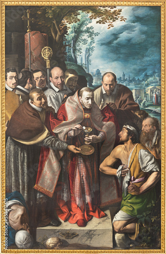DOMODOSSOLA, ITALY - JULY 19, 2022: The painting Saint Charles Borromeo gives Holy Communion during the plague epidemic in church Chiesa dei Santi Gervasio e Protasio by Tanzio da Varallo (1515 - 1516