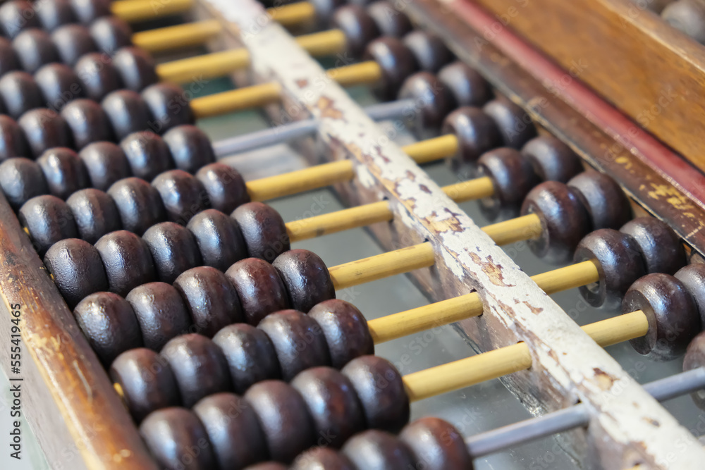 close up Chinese abacus (Suanpan). A calculating tool since ancient times close up Chinese abacus (Suanpan). A calculating tool since ancient times
