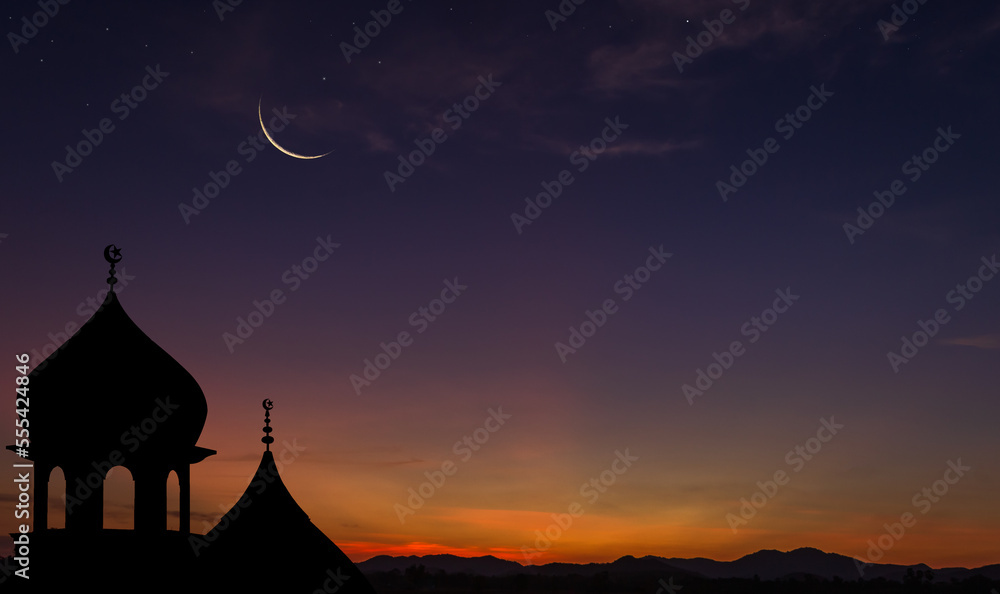 Crescent moon over dome mosques on dusk sky in the evening on twilight religion of Islamic and free space for text Ramadan Kareem, Eid Al Adah,Eid Al Fitr, Mubarak, Muharram
